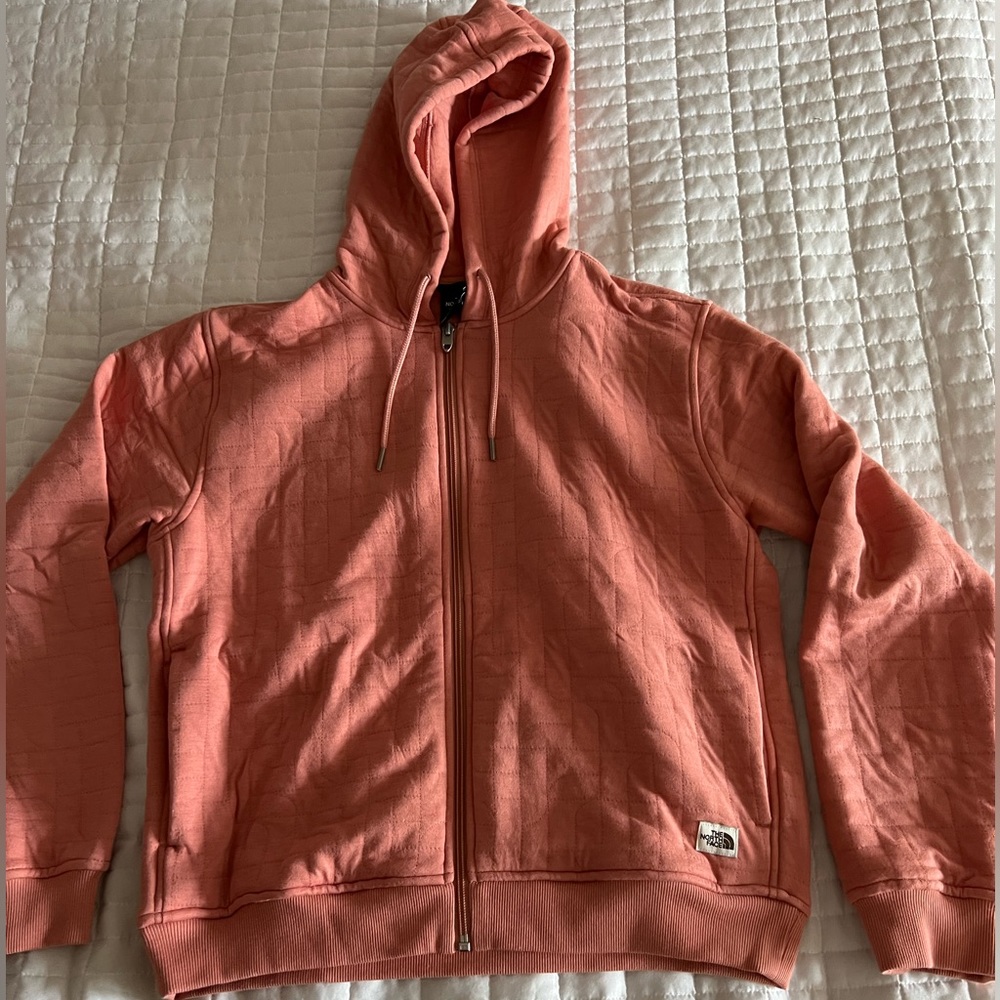 Woman’s north face pink zip up size medium